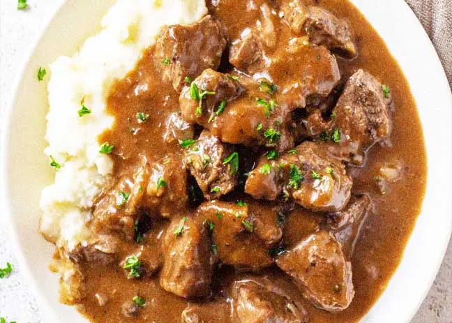 image of slow cooker beef tips with gravy