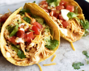 Slow Cooker Queso Chicken Tacos